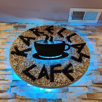 Karellas Cafe - a cake with a smiley face on it - Greek Near Me - Baltimore, Maryland