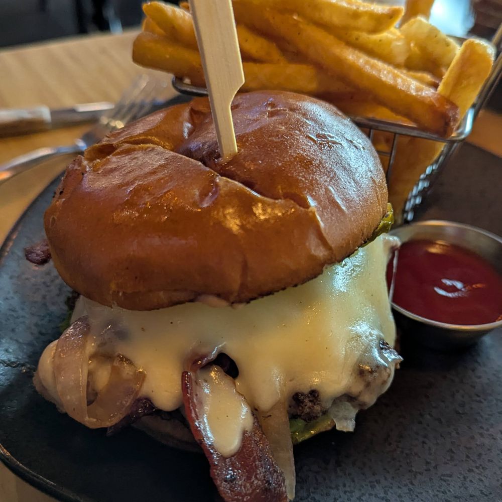 The Madness - Candler - Look at this chonker of a burger. Wow. It was very tasty and cheesy. - Asian Fusion Near Me - Asheville, North Carolina The Madness - Candler - Look at this chonker of a burger. Wow. It was very tasty and cheesy. - Asian Fusion Near Me - Asheville, North Carolina
