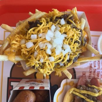 Tail O' the Pup - chili cheese fries: nacho cheese, shredded cheese, raw onions + chili = $7.95 - Burgers Near Me - West Hollywood, California Tail O' the Pup - chili cheese fries: nacho cheese, shredded cheese, raw onions + chili = $7.95 - Burgers Near Me - West Hollywood, California