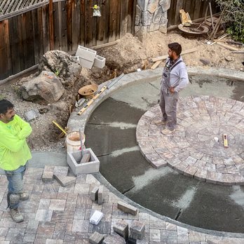 Fernandez & Sons Landscaping - a man and a boy in a backyard setting - Landscaping Near Me - Concord, California Fernandez & Sons Landscaping - a man and a boy in a backyard setting - Landscaping Near Me - Concord, California