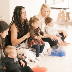 New Mom School - Southwest Las Vegas - New moms sit on the floor with their infants learning from the class instructor