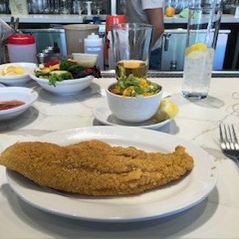 Treebeards - The delicious fried catfish with red beans & rice and salad in the background. - Southern Near Me - Houston, Texas Treebeards - The delicious fried catfish with red beans & rice and salad in the background. - Southern Near Me - Houston, Texas