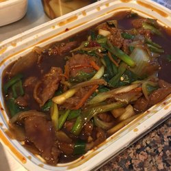 Golden City Chinese Cuisine - Mongolian Beef. If only the meat wasn't so cheap. It wasn't spicy, but had a slight warmth. Very tasty with the rice however.