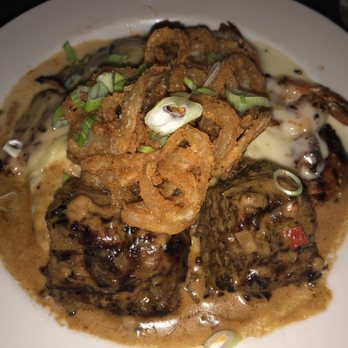 Moonshine Grill - Special: grilled chicken shrimp and steak on a bed of garlic potatoes topped with fried onion strings - Southern Near Me - Austin, Texas