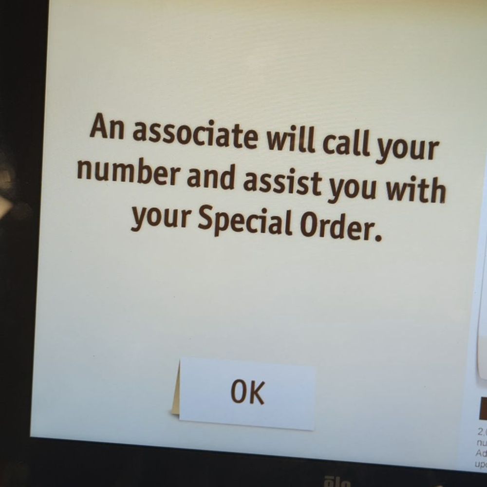 a cell phone displaying an associate will call your number and assist you with your special order a cell phone displaying an associate will call your number and assist you with your special order