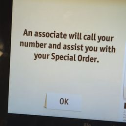 a cell phone displaying an associate will call your number and assist you with your special order
