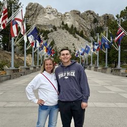 Mount Rushmore National Memorial - Avenue of flags leading up to monument.