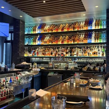 Firebirds Wood Fired Grill - Love the liquor art display! - Steakhouses Near Me - Lees Summit, Missouri