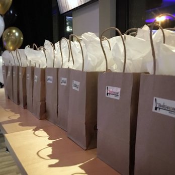 Balthazar - a row of brown paper bags on a table - Pubs Near Me - Quebec City, Quebec Balthazar - a row of brown paper bags on a table - Pubs Near Me - Quebec City, Quebec