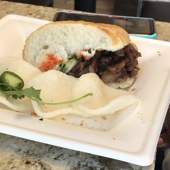 Vietshack - Sandwich consumption in progress. This is only half of what arrives to your table. So good! - Vietnamese Near Me - Tempe, Arizona