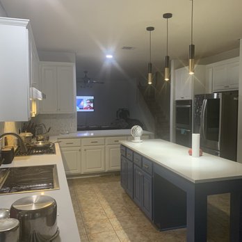 OnPoint - a kitchen with a large island - General Contractors Near Me - Austin, Texas
