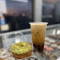 Ice coffee with pistachio croissant donuts