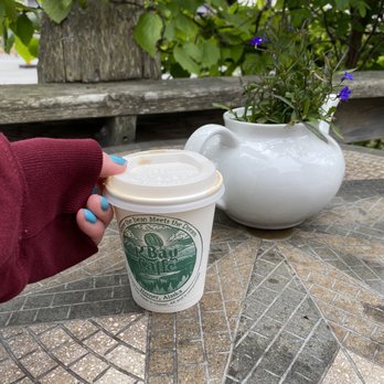 Coal Town Coffee & Tea - a hand holding a coffee cup - Coffee & Tea Near Me - Homer, Alaska