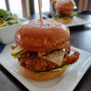 Dominion Bar + Kitchen - Crispy chicken sandwich $18.00 - Canadian (New) Near Me - Surrey, British Columbia