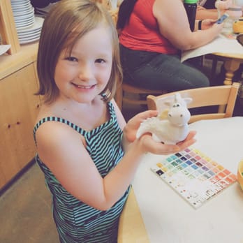 Color Me Mine - Charlotte and her dragon (which will be pink and purple after firing). - Paint-Your-Own Pottery Near Me - Aurora, Colorado