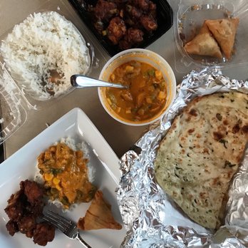Biryani Pot - Top going clockwise - gobi manchurian, samosas, garlic naan. Center - navarathan kurma. Also seen, plain rice & my plate full of goodness! - Indian Near Me - San Antonio, Texas