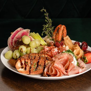 Amendment 21 - a plate of meat and fruit - Cocktail Bars Near Me - Bellingham, Washington