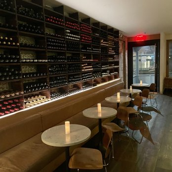 Bottino - rows of wine bottles in a wine cellar - Italian Near Me - New York, New York