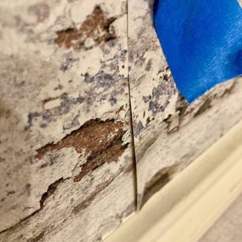 CM Wallpaper - peeling paint on a wall - General Contractors Near Me