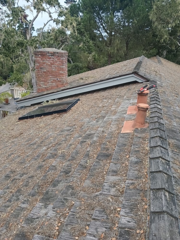 Slide of Rick's Roof & Gutter Cleaning Service