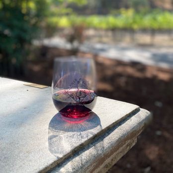 Beringer Vineyards - a glass of wine on a table - Wineries Near Me - St. Helena, California