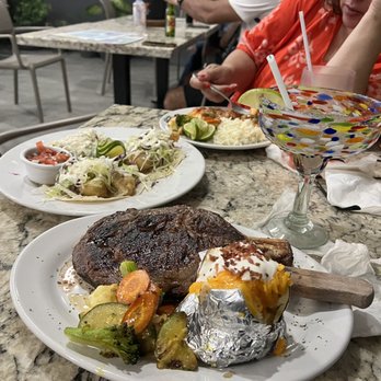Jax Bar & Grill - Ribeye steak loaded baked potato and vegetables. Baja tacos and margarita. - American Near Me - Isla Mujeres, MOR