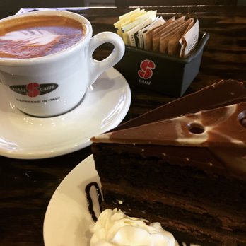 Valerio Bakery Café - Chocolate Ganache slice & latte with leaf design - Coffee & Tea Near Me - College Point, New York Valerio Bakery Café - Chocolate Ganache slice & latte with leaf design - Coffee & Tea Near Me - College Point, New York