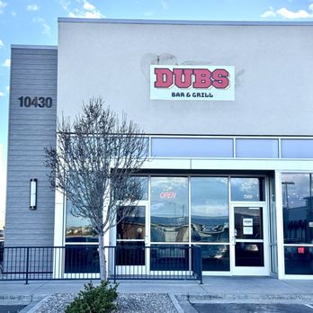 Dubs Bar & Grill - Parking lot facing facade and entrance - Sports Bars Near Me - Commerce City, Colorado