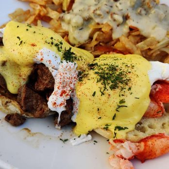 Toast Kitchen & Bar - Surf and turf eggs benedict. Country gravy on hash chips - Breakfast & Brunch Near Me - Brea, California Toast Kitchen & Bar - Surf and turf eggs benedict. Country gravy on hash chips - Breakfast & Brunch Near Me - Brea, California