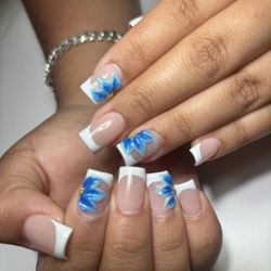 Hand-painted 3D floral nail art and luxury manicure at Polished Nail Bar DTLA.