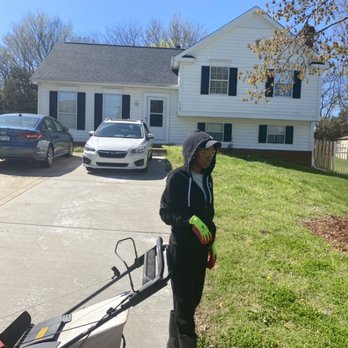 West Lawn Care - a woman with a lawn mower in front of a house - Lawn Services Near Me West Lawn Care - a woman with a lawn mower in front of a house - Lawn Services Near Me
