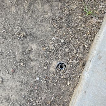Artificial Grass Guru - Second sprinkler head cut off at ground level. - Artificial Turf Near Me Artificial Grass Guru - Second sprinkler head cut off at ground level. - Artificial Turf Near Me