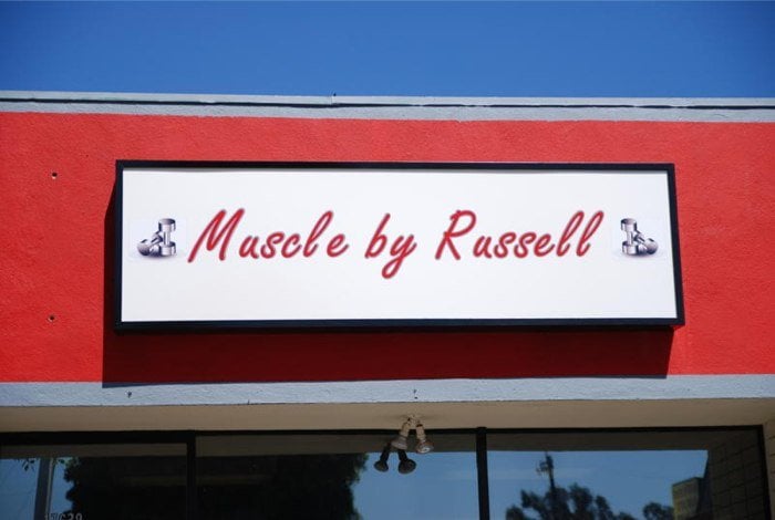 Muscle by Russell Logo