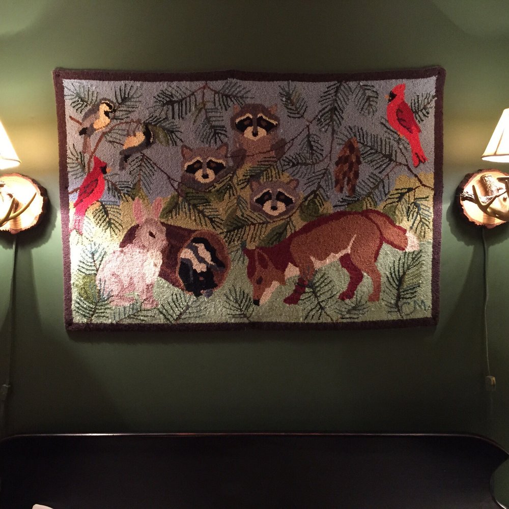 Same piece of yarn art above both beds - yikes! Same piece of yarn art above both beds - yikes!