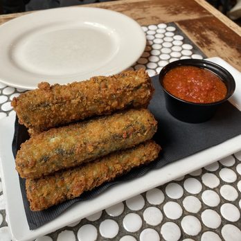 Gino's East - South Loop - Spinach Famous Handrolled Mozzarella Sticks - Pizza Near Me - Chicago, Illinois Gino's East - South Loop - Spinach Famous Handrolled Mozzarella Sticks - Pizza Near Me - Chicago, Illinois