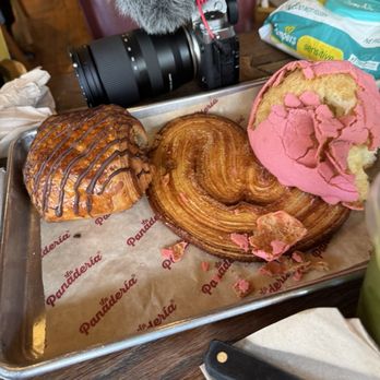 La Panadería - A pink concha already devoured lol and a chocolate croissant with a Spanish sweet bread called oreja. So delicious - Breakfast & Brunch Near Me - San Antonio, Texas La Panadería - A pink concha already devoured lol and a chocolate croissant with a Spanish sweet bread called oreja. So delicious - Breakfast & Brunch Near Me - San Antonio, Texas