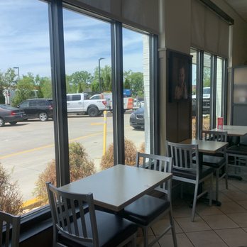 Chick-fil-A - ows tables and chairs in a restaurant - Fast Food Near Me - Franklin, Tennessee