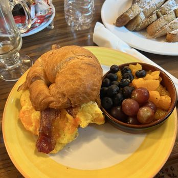 Honeycomb Cafe - Fall Menu: Croissant Sandwich with a side of fruit - New American Near Me - Belmont, North Carolina