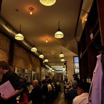 J's Steak Frites - people sitting at tables in a restaurant - Steakhouses Near Me - Toronto, Ontario