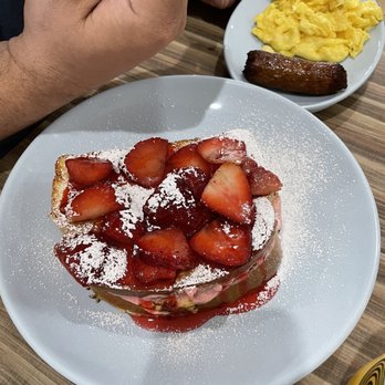 @ The Diner - Stuffed layered strawberry French toast with a side of egg and sausage - Breakfast & Brunch Near Me - Orlando, Florida