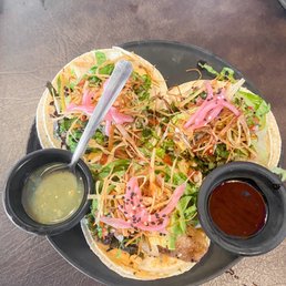 Fish tacos with tamarindo sauce and green salsa Fish tacos with tamarindo sauce and green salsa