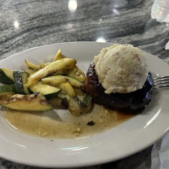 Shenanigans - Round meatloaf wrapped with bacon. Zucchini, squash, and mashed potatoes. - American Near Me - Metairie, Louisiana Shenanigans - Round meatloaf wrapped with bacon. Zucchini, squash, and mashed potatoes. - American Near Me - Metairie, Louisiana