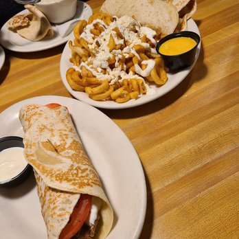 Olga's Kitchen - two plates of food on a table - Sandwiches Near Me - Dearborn Heights, Michigan Olga's Kitchen - two plates of food on a table - Sandwiches Near Me - Dearborn Heights, Michigan