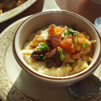 Another Broken Egg Cafe - City grits with gouda, bacon, tomato and green onion. - Breakfast & Brunch Near Me - Clearwater Beach, Florida Another Broken Egg Cafe - City grits with gouda, bacon, tomato and green onion. - Breakfast & Brunch Near Me - Clearwater Beach, Florida