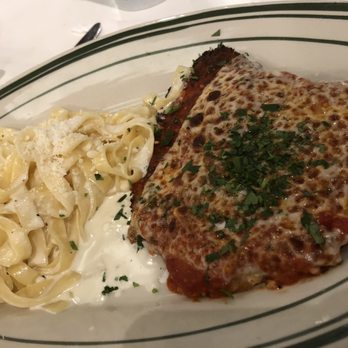 Mandola's Italian Kitchen - Chicken Parmesan comes with a side of fettuccine alfredo - Italian Near Me - Riverview, Florida Mandola's Italian Kitchen - Chicken Parmesan comes with a side of fettuccine alfredo - Italian Near Me - Riverview, Florida