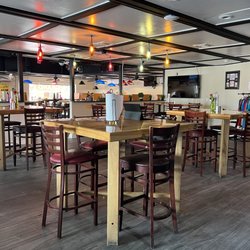 Busters Sports Tavern - Belly up to our bar area for some cold cocktails, and watch your favorite team on our 30 TVs!