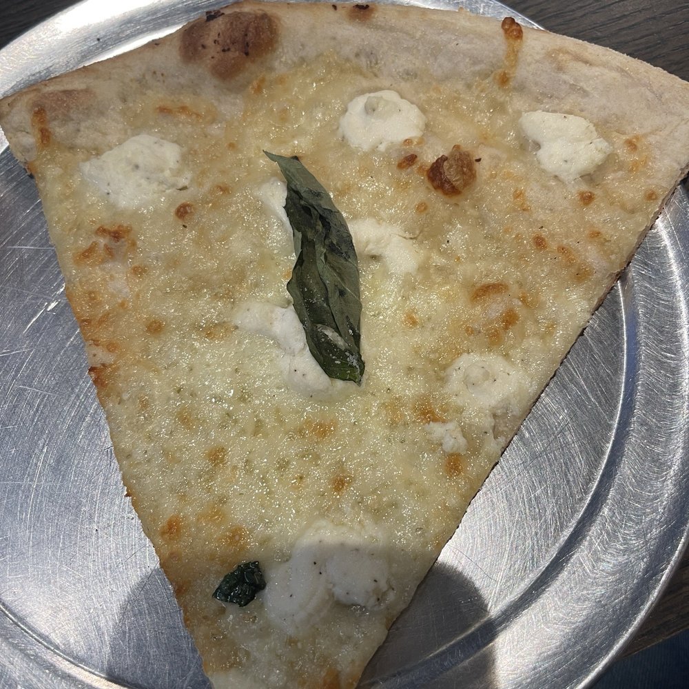 Limoncello Pizzeria - White garlic pizza slice. Tasted amazing. - Pizza Near Me - Baltimore, Maryland Limoncello Pizzeria - White garlic pizza slice. Tasted amazing. - Pizza Near Me - Baltimore, Maryland