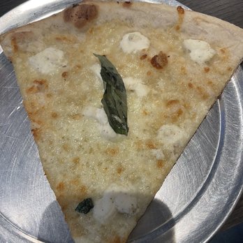 Limoncello Pizzeria - White garlic pizza slice.  Tasted amazing. - Pizza Near Me - Baltimore, Maryland