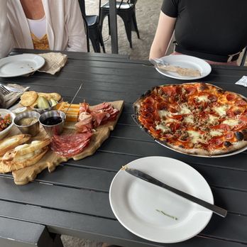 Amato's Woodfired Pizza - a woman sitting at a table - Pizza Near Me - Delaware, Ohio Amato's Woodfired Pizza - a woman sitting at a table - Pizza Near Me - Delaware, Ohio