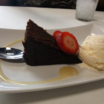 Yah Mon - Rum cake warm moist delicious with ice cream - Caribbean Near Me - Tampa, Florida
